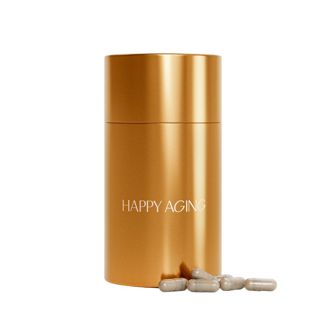 Gold cylindrical container labeled 'Happy Aging' with beige capsules on a white background
