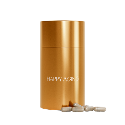 Gold cylindrical container labeled 'Happy Aging' with beige capsules on a white background